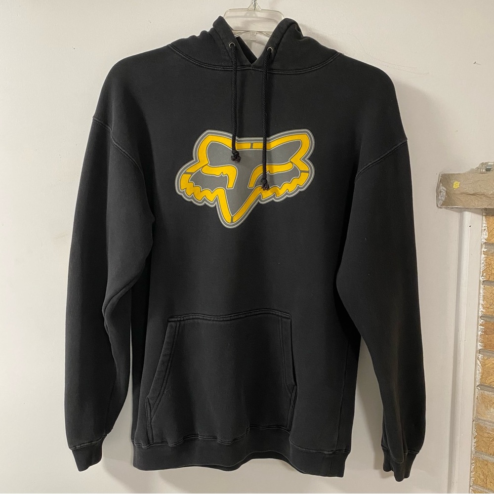 Black hooded sweatshirt with yellow and grey Fox logo